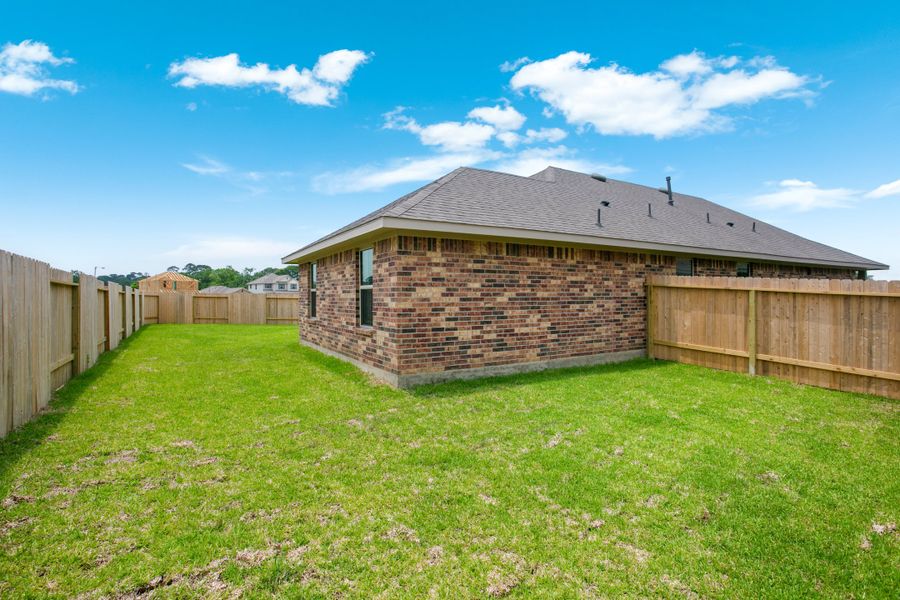 Front exterior of a new home in Bayou Maison, Texas City, TX, highlighting curb appeal (Image 17).