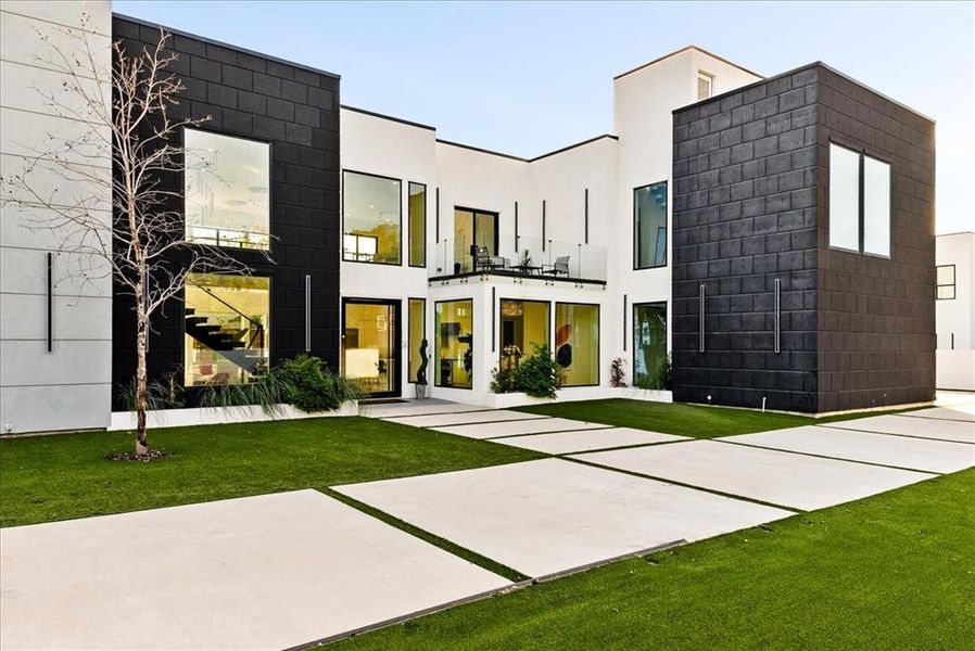 Front of property with fully turfed yard, driveway extension and view to Balcony