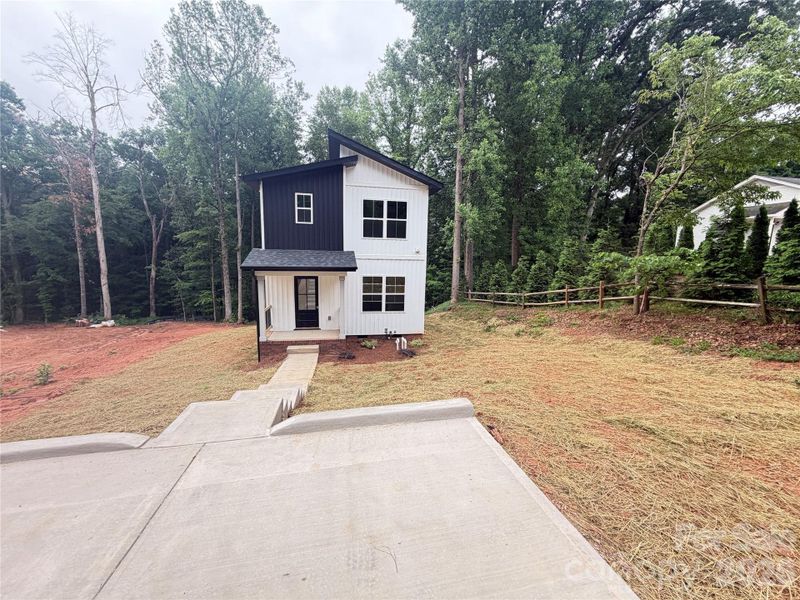 Front exterior of a new home in , Troutman, NC, highlighting curb appeal (Image 1). Front exterior of a new home in , Troutman, NC, highlighting curb appeal (Image 1).