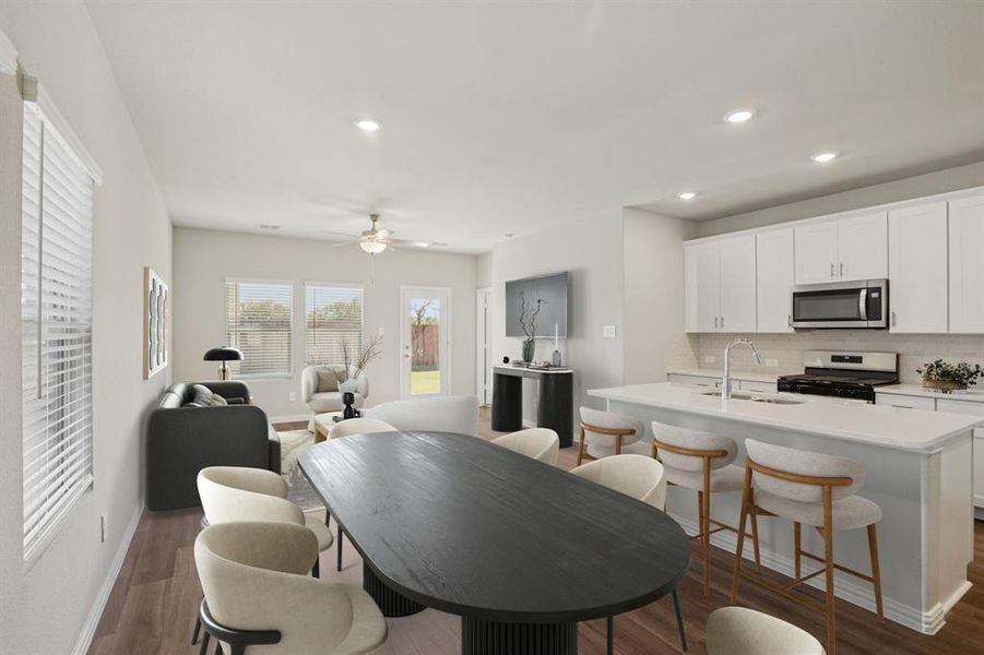 Dining room with recessed lighting, a ceiling fan, and dark wood-type flooring