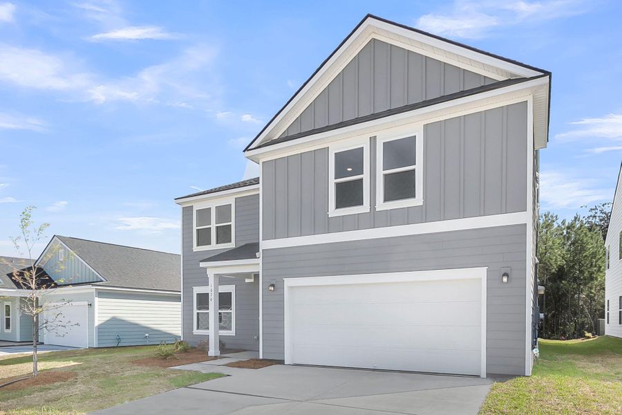 Front exterior of a new home in , Ravenel, SC, highlighting curb appeal (Image 18).