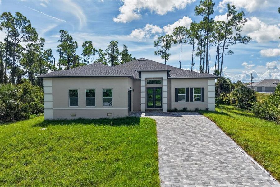 Front exterior of a new home in , Port Charlotte, FL, highlighting curb appeal (Image 27).