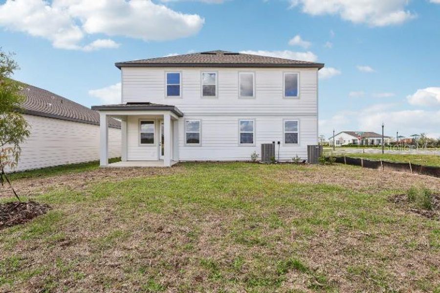 Exterior details and patio area of a home in Trailside, Mount Dora (Image 22).