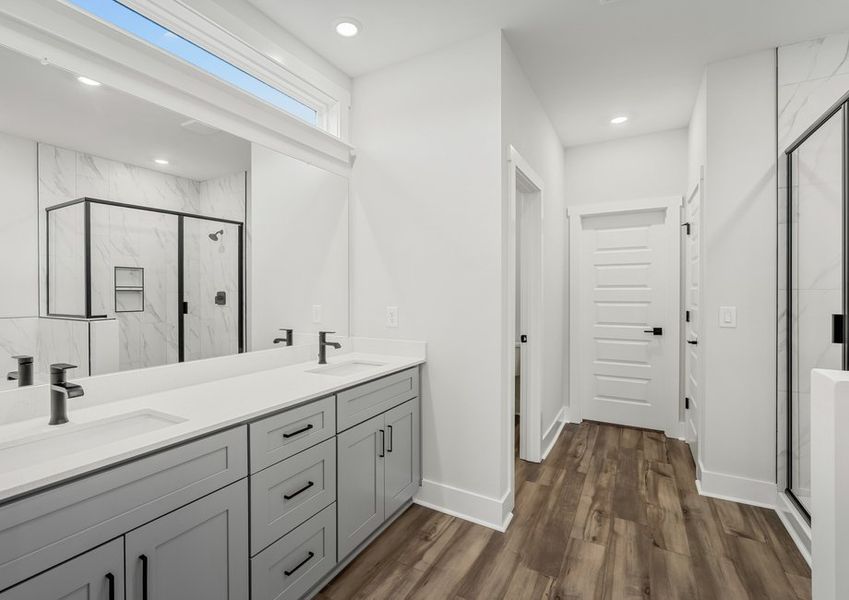 Master bath has a soaker tub and a walk-in shower.