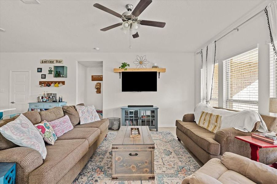 Living room featuring ceiling fan