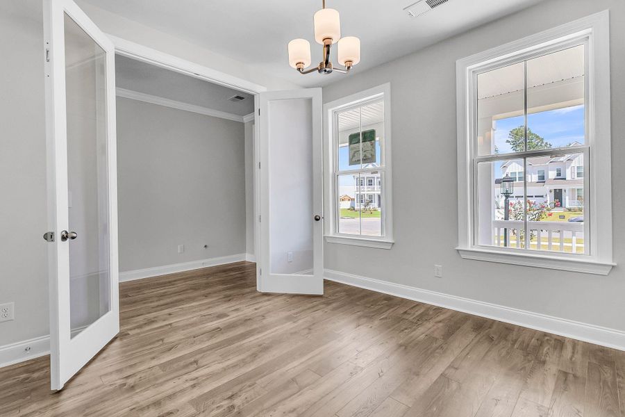 Spacious, unfurnished interior of a new home in Tidewater at Lakes of Cane Bay, Summerville (Image 15).