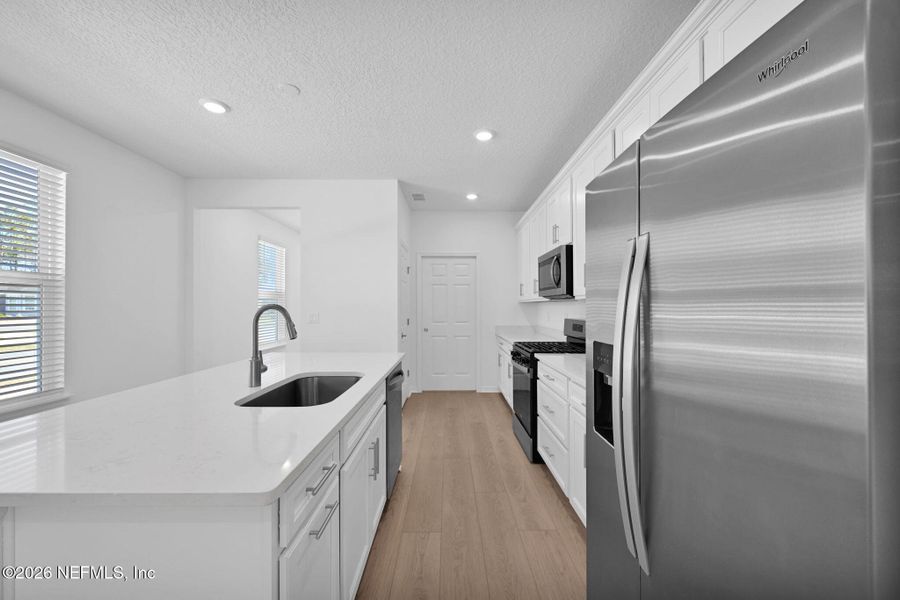 Furnished interior view inside a new home in Del Webb Wildlight, Yulee (Image 7).