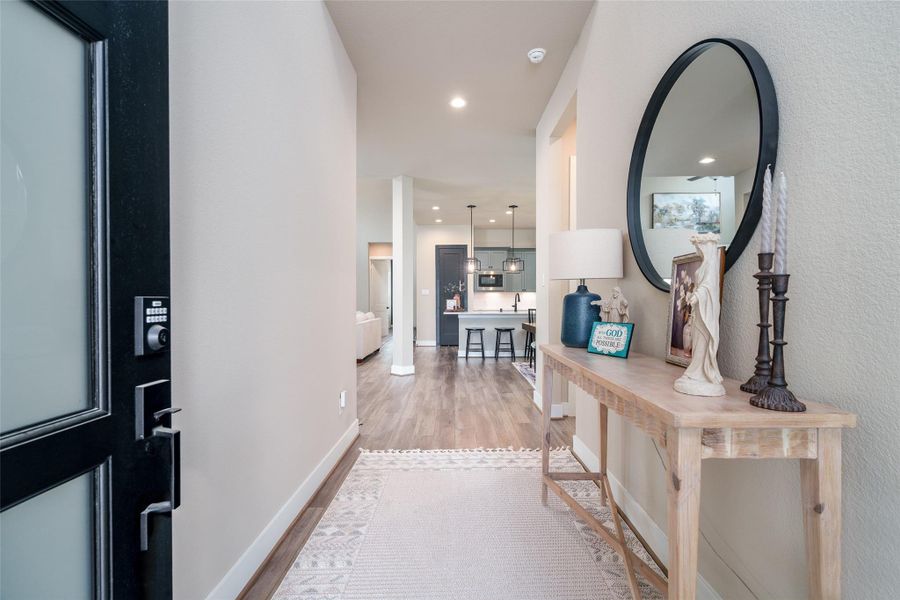 Welcome in! You're greeted with high ceilings and an 8' Mahogany door. Welcome in! You're greeted with high ceilings and an 8' Mahogany door.