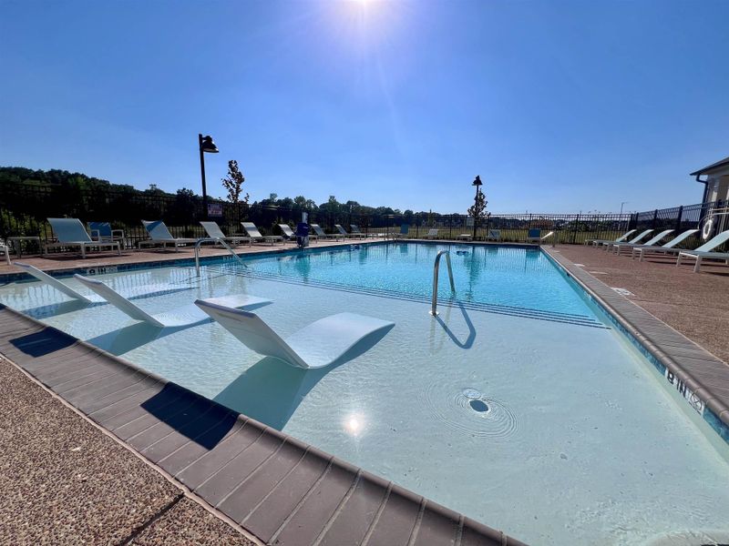 Community pool featuring a patio