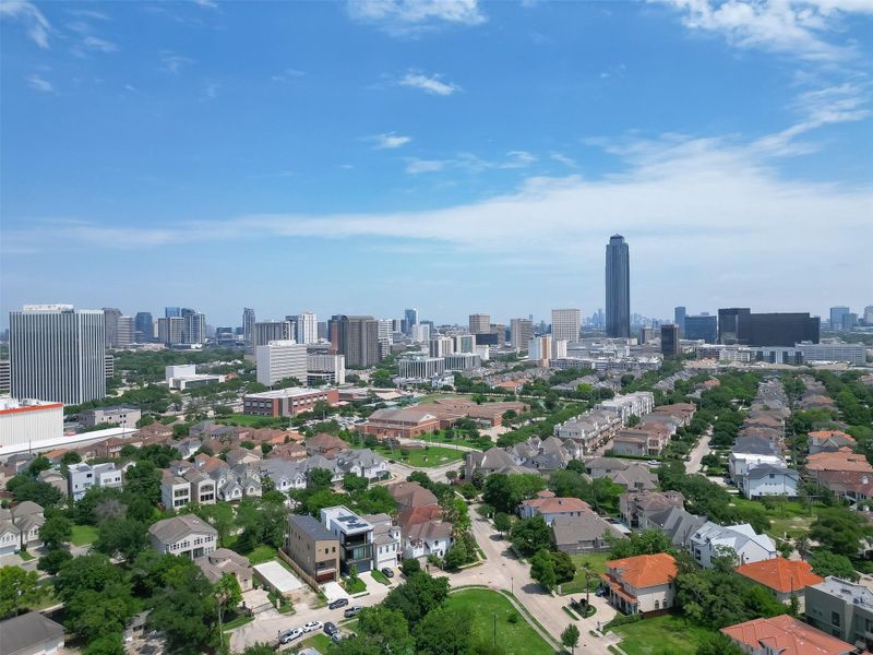 You're looking at an urban panorama with a mix of residential neighborhoods in the foreground and a bustling city skyline in the distance, suggesting a vibrant area with access to downtown amenities and a suburban feel. You're looking at an urban panorama with a mix of residential neighborhoods in the foreground and a bustling city skyline in the distance, suggesting a vibrant area with access to downtown amenities and a suburban feel.