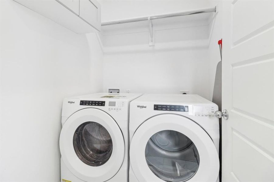 Laundry room with separate washer and dryer and laundry area Laundry room with separate washer and dryer and laundry area