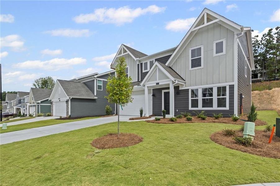 Front exterior of a new home in Sage Woods, Dallas, GA, highlighting curb appeal (Image 20).