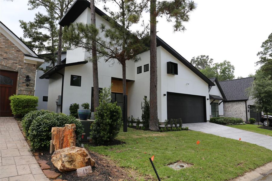 Front exterior of a new home in , Montgomery, TX, highlighting curb appeal (Image 2).