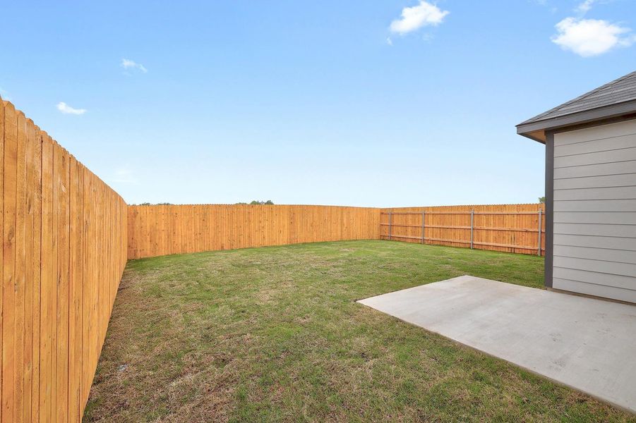 Exterior details and patio area of a home in Trinity Ranch, Elgin (Image 13).