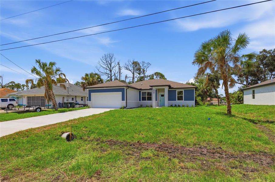 Front exterior of a new home in , North Port, FL, highlighting curb appeal (Image 24). Front exterior of a new home in , North Port, FL, highlighting curb appeal (Image 24).