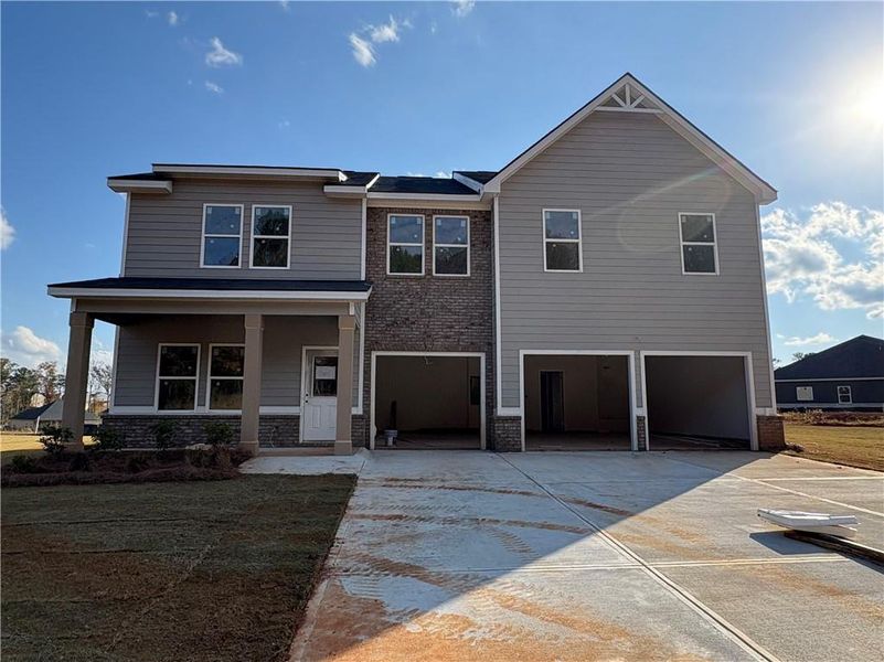 Front exterior of a new home in Southern Hills, McDonough, GA, highlighting curb appeal (Image 2).