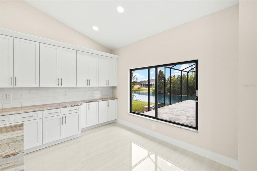 Dining area with view of canal/pool and nook, can be coffee bar/bar Dining area with view of canal/pool and nook, can be coffee bar/bar