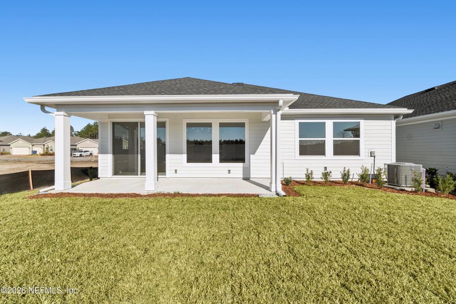 Exterior details and patio area of a home in Tributary 50', Yulee (Image 4).