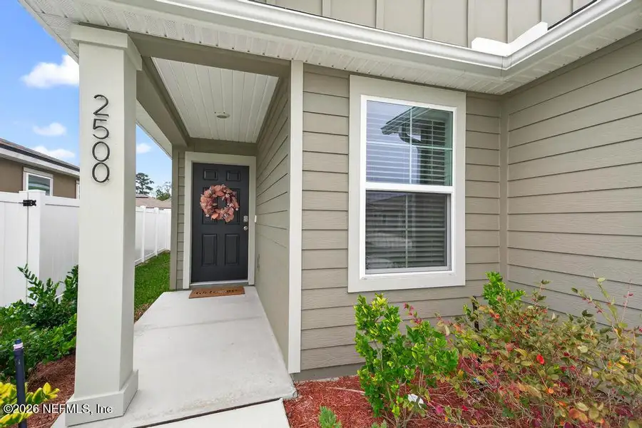 Exterior details and patio area of a home in Cross Creek Express, Green Cove Springs (Image 4).