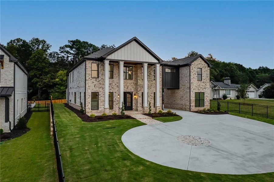Front exterior of a new home in , Buford, GA, highlighting curb appeal (Image 32). Front exterior of a new home in , Buford, GA, highlighting curb appeal (Image 32).