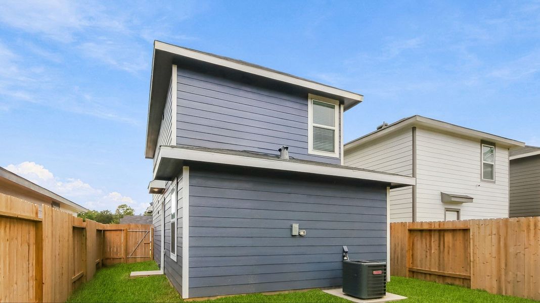 Exterior details and patio area of a home in Baron Village, Conroe (Image 3).