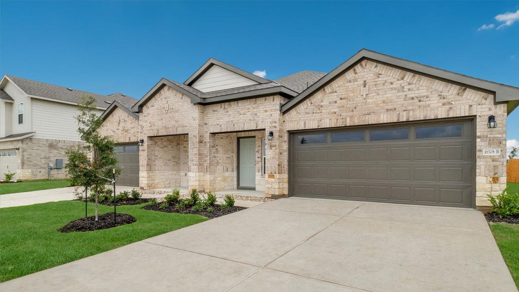 Front exterior of a new home in Palomino, Manor, TX, highlighting curb appeal (Image 14).