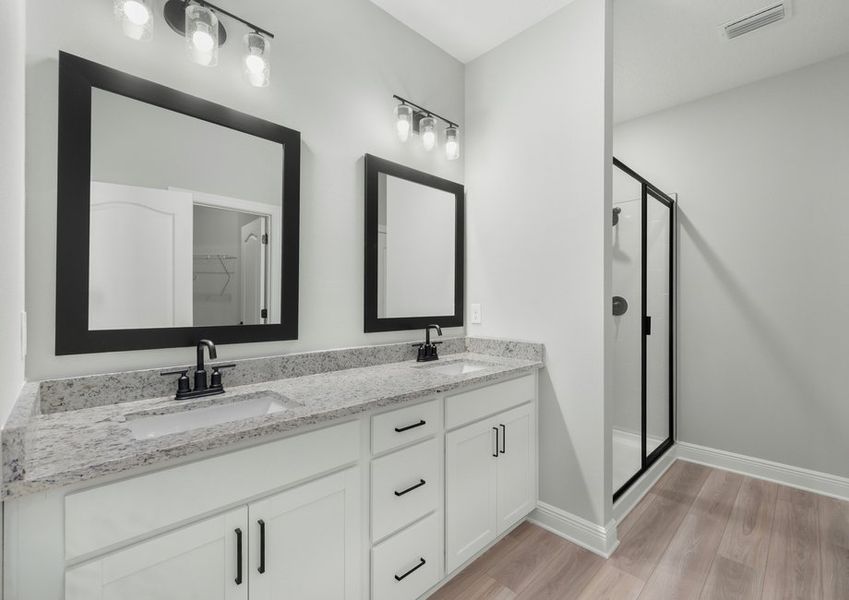The master bathroom includes a stunning dual sink vanity!