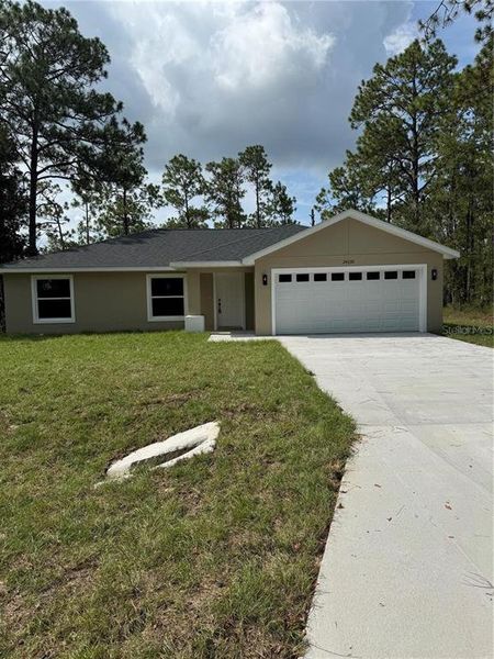 Front exterior of a new home in , Ocala, FL, highlighting curb appeal (Image 1).