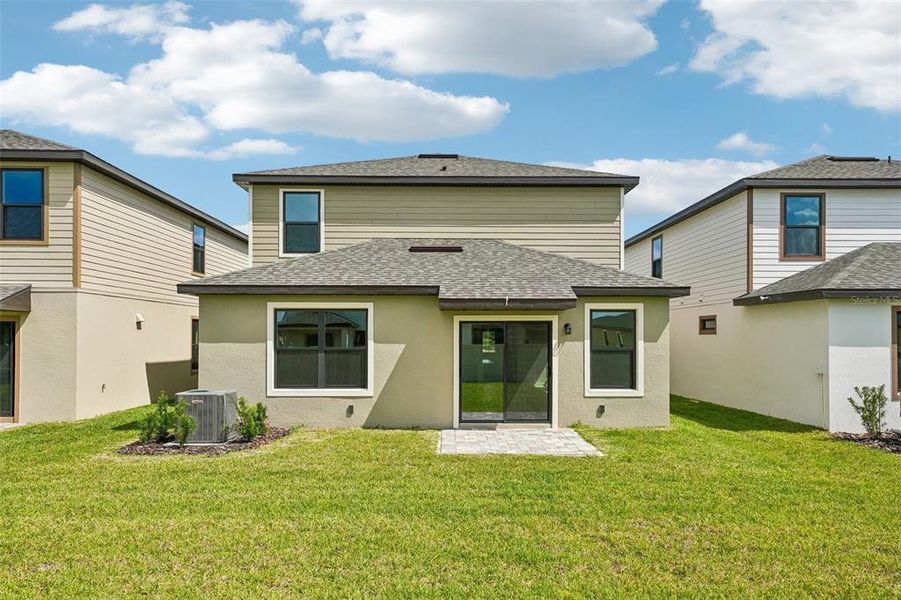 Exterior details and patio area of a home in Grasslands West, Lakeland (Image 27).