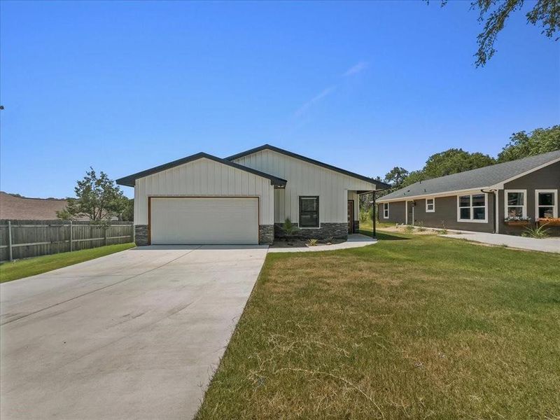 Front exterior of a new home in , Granbury, TX, highlighting curb appeal (Image 20). Front exterior of a new home in , Granbury, TX, highlighting curb appeal (Image 20).