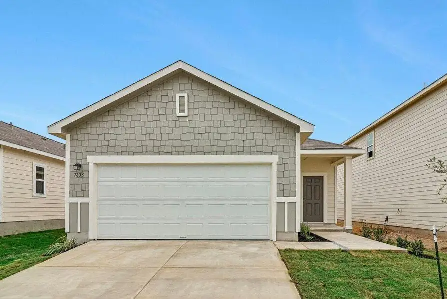 Front exterior of a new home in Royal Pines, Porter, TX, highlighting curb appeal (Image 1). Front exterior of a new home in Royal Pines, Porter, TX, highlighting curb appeal (Image 1).