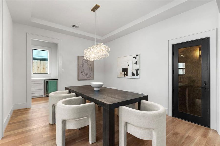 Formal Dining Room opens to Family, Kitchen, Butler's Pantry & A RARE temp controlled wine room.