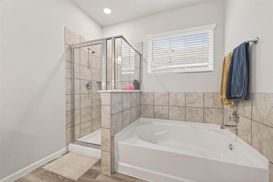 Enjoy a quick glass-enclosed shower on busy mornings or a long soak in the deep tub when it's time to unwind.