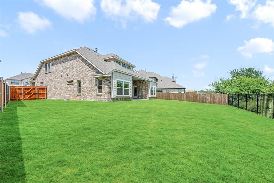 Exterior details and patio area of a home in Glenwood Meadows, Lantana (Image 2). Exterior details and patio area of a home in Glenwood Meadows, Lantana (Image 2).
