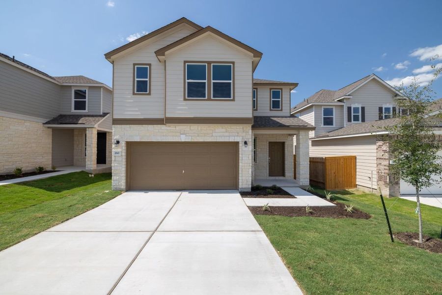 Front exterior of a new home in Sonterra - Cool Water, Jarrell, TX, highlighting curb appeal (Image 1). Front exterior of a new home in Sonterra - Cool Water, Jarrell, TX, highlighting curb appeal (Image 1).
