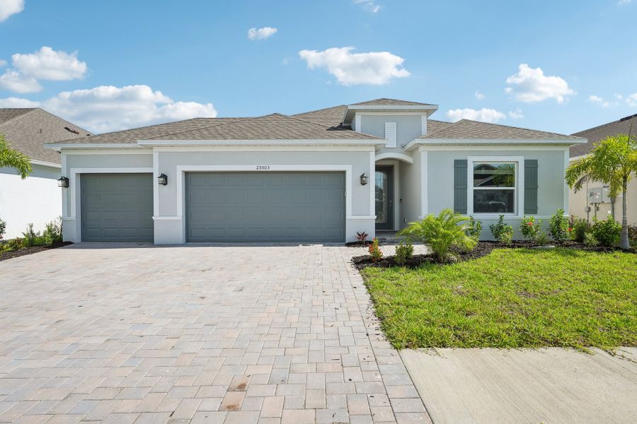 Front exterior of a new home in Heritage Station, Punta Gorda, FL, highlighting curb appeal (Image 27).