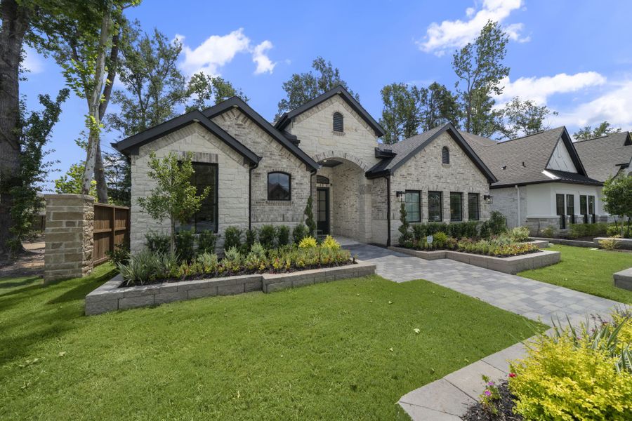 Front exterior of a new home in The Highlands, Porter, TX, highlighting curb appeal (Image 19).