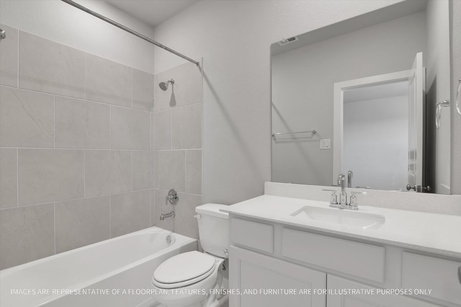 Furnished interior view inside a new home in Sunterra 50s, Katy (Image 14).