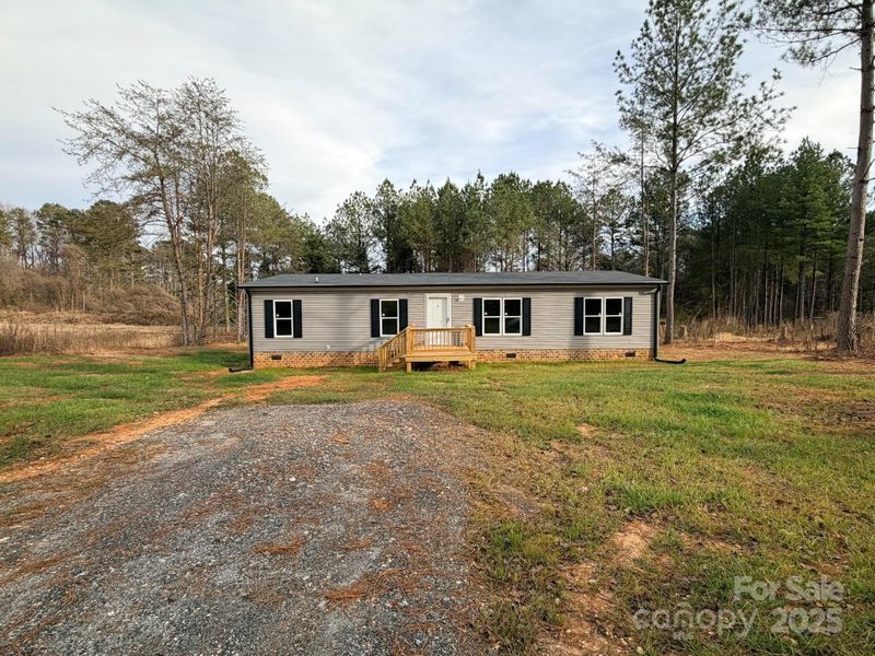Exterior details and patio area of a home in , Statesville (Image 13).