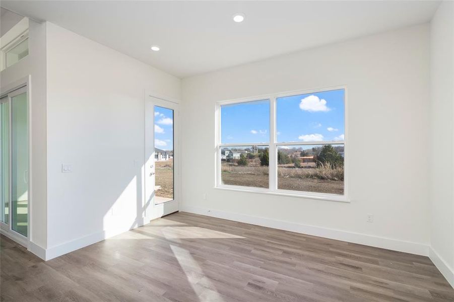 Spare room with wood-type flooring