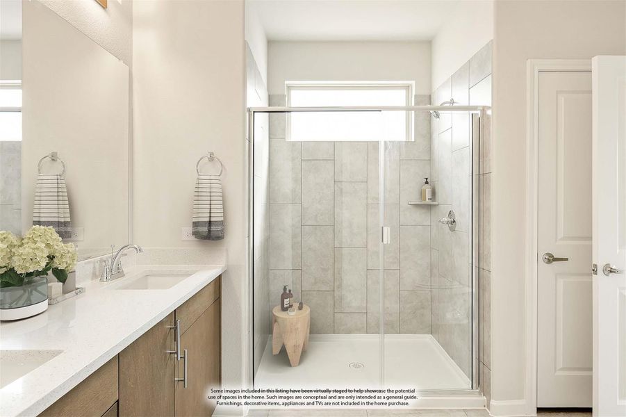 Bathroom with walk-in glass shower, tile walls, wood vanity, and white quartz countertop Bathroom with walk-in glass shower, tile walls, wood vanity, and white quartz countertop
