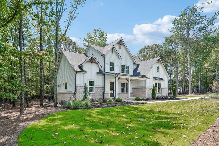 Front exterior of a new home in , Cumming, GA, highlighting curb appeal (Image 29).