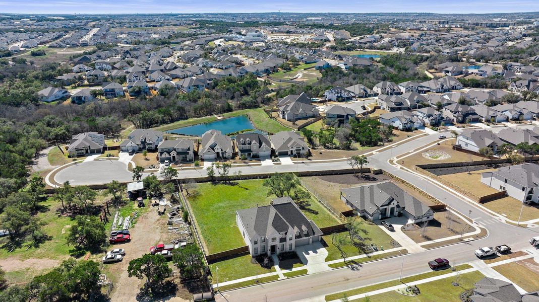 Drone / aerial view featuring a water view and a residential view