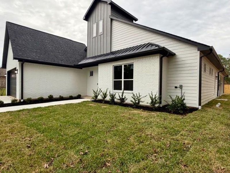 Exterior details and patio area of a home in , Magnolia (Image 3). Exterior details and patio area of a home in , Magnolia (Image 3).