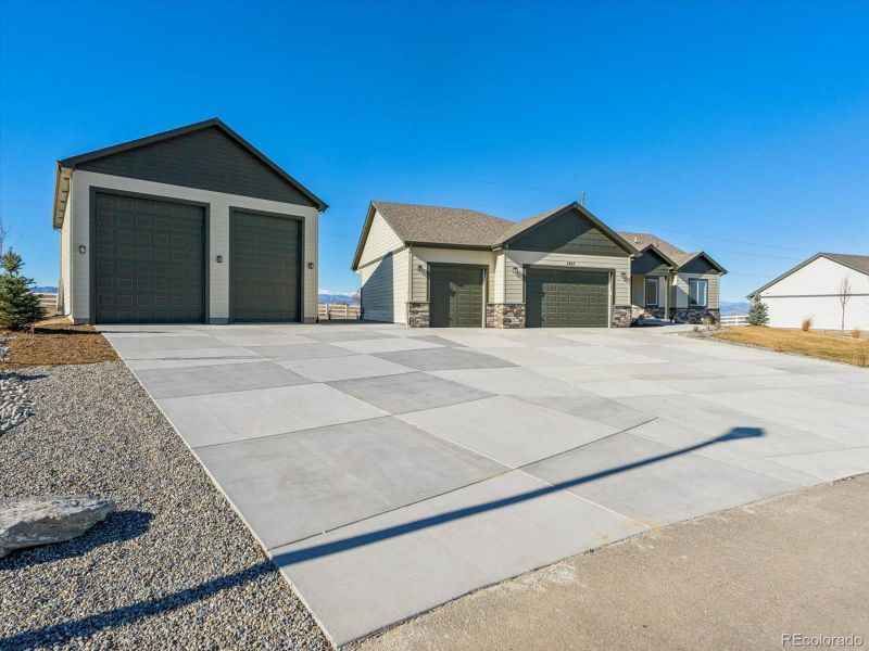 Front exterior of a new home in , Dacono, CO, highlighting curb appeal (Image 18).