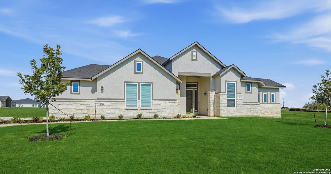 Front exterior of a new home in Sienna Lakes, San Antonio, TX, highlighting curb appeal (Image 2). Front exterior of a new home in Sienna Lakes, San Antonio, TX, highlighting curb appeal (Image 2).