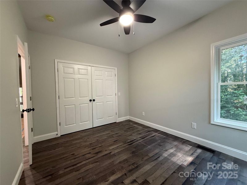 Primary Bedroom looking toward Primary Bathroom 1 and door