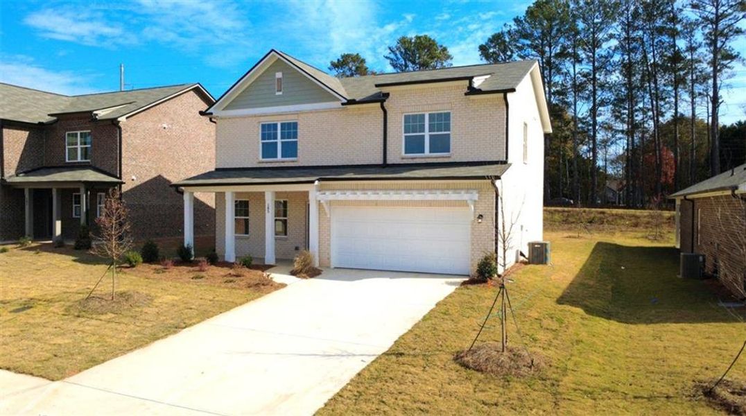 Front exterior of a new home in Kendall Grove, McDonough, GA, highlighting curb appeal (Image 2).
