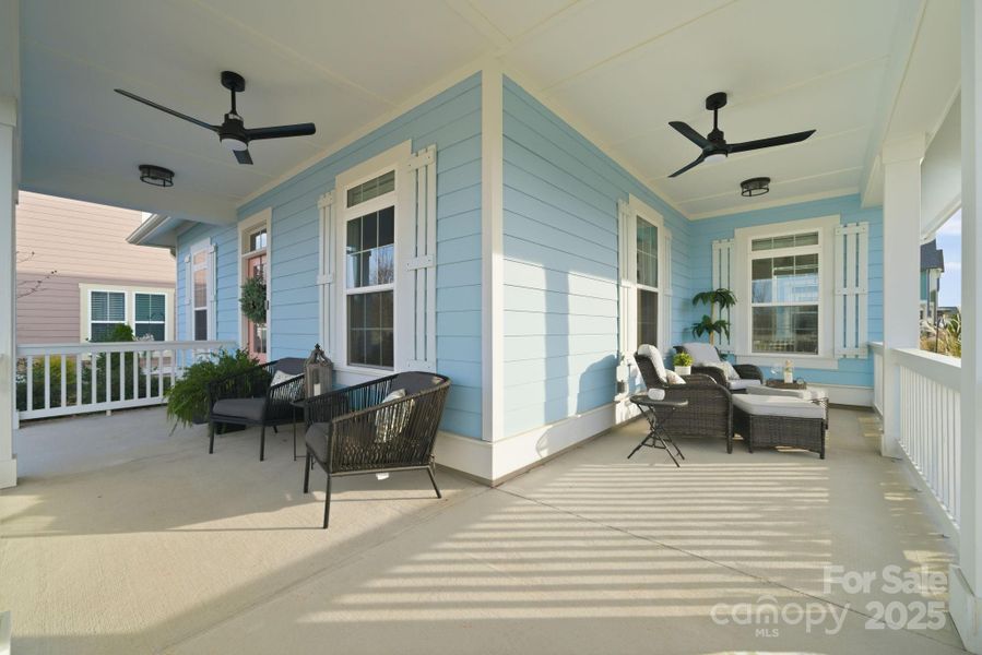Large wrap-around front porch with ceiling fans