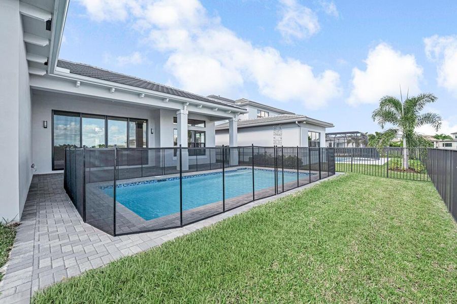 Front exterior of a new home in Apex at Avenir, Palm Beach Gardens, FL, highlighting curb appeal (Image 22). Front exterior of a new home in Apex at Avenir, Palm Beach Gardens, FL, highlighting curb appeal (Image 22).